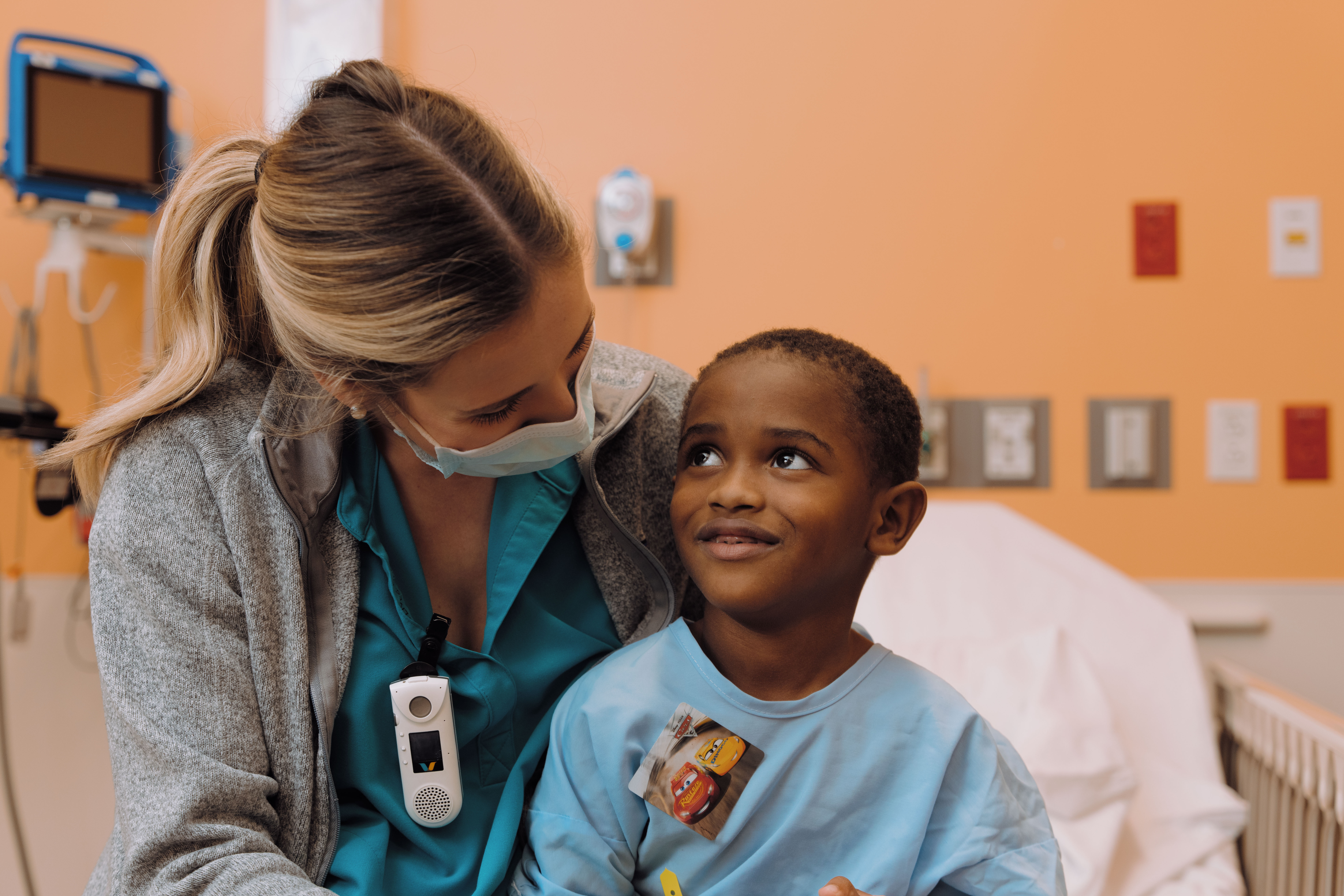 little boy smiling with nurse