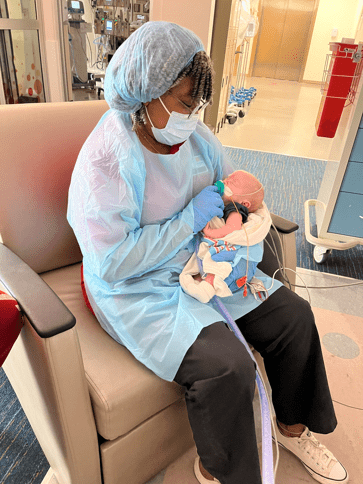 Woman holding baby in the NICU