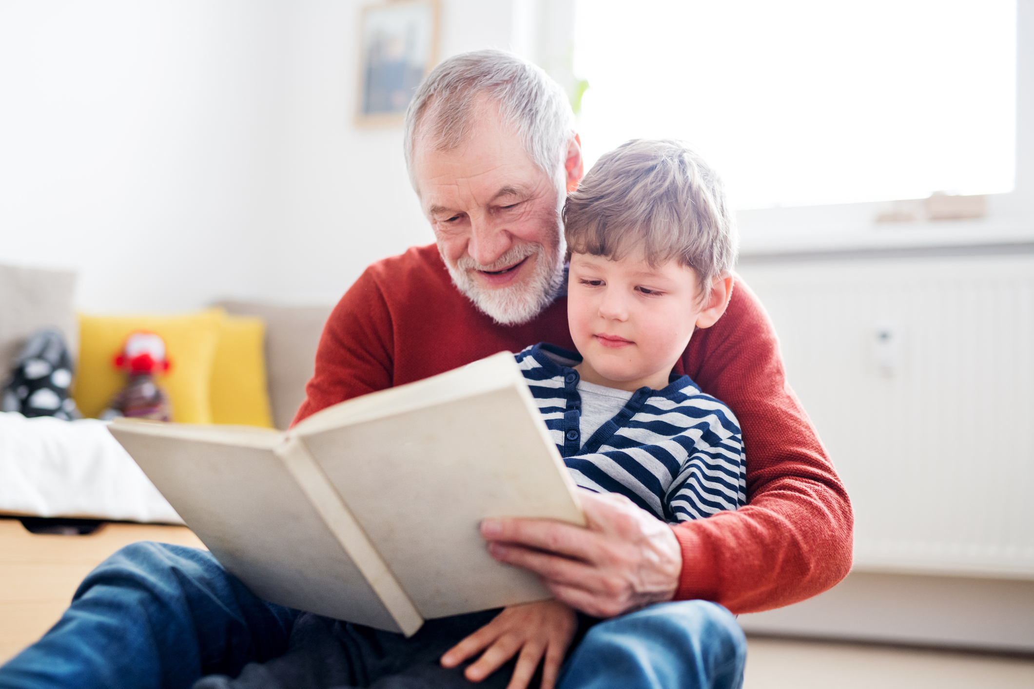 grandfather reading to grandson