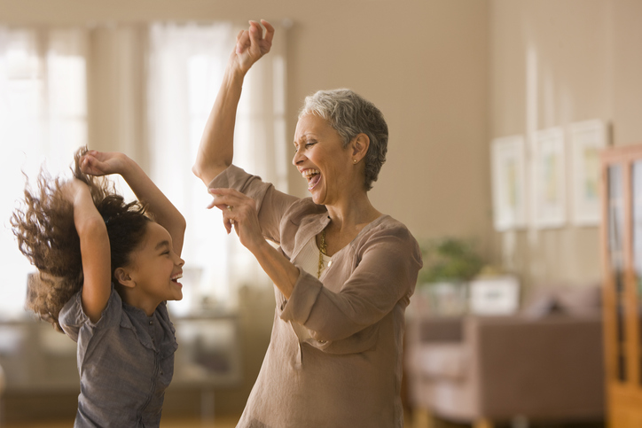 grandmother and granddaughter dancing 