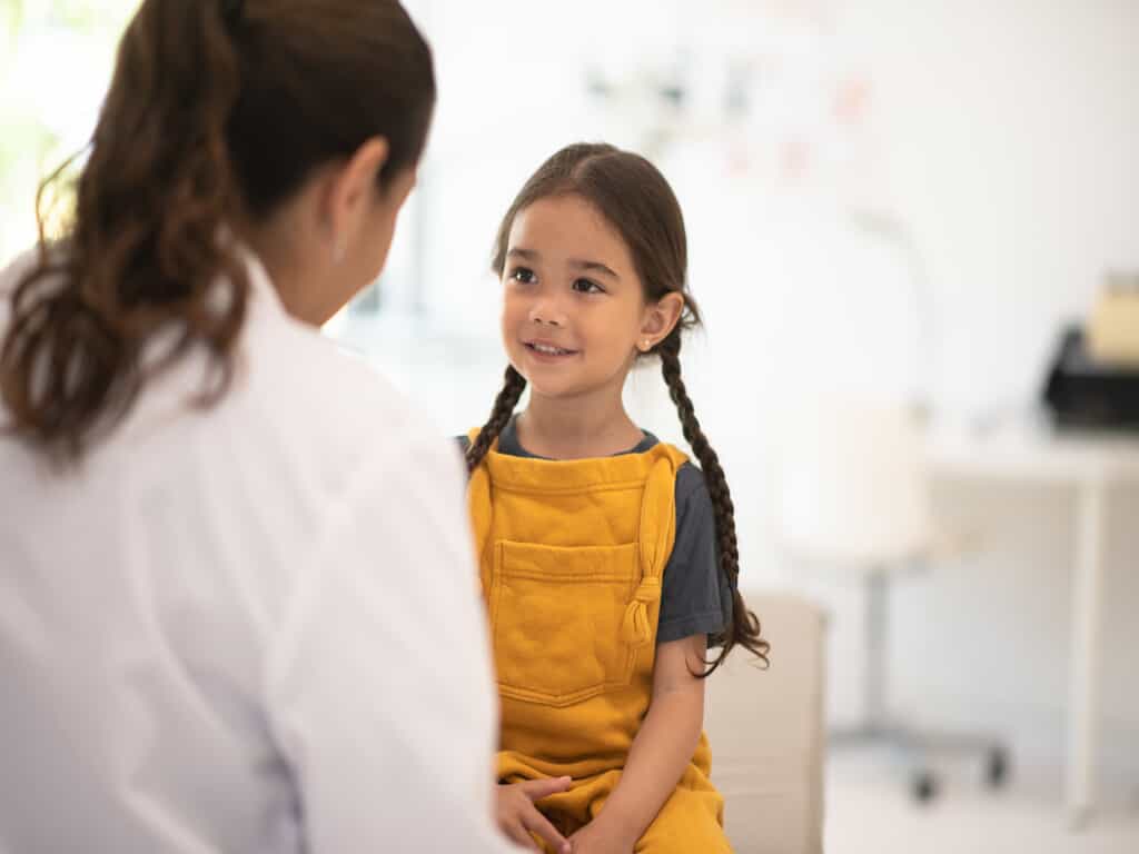 smiling child with doctor