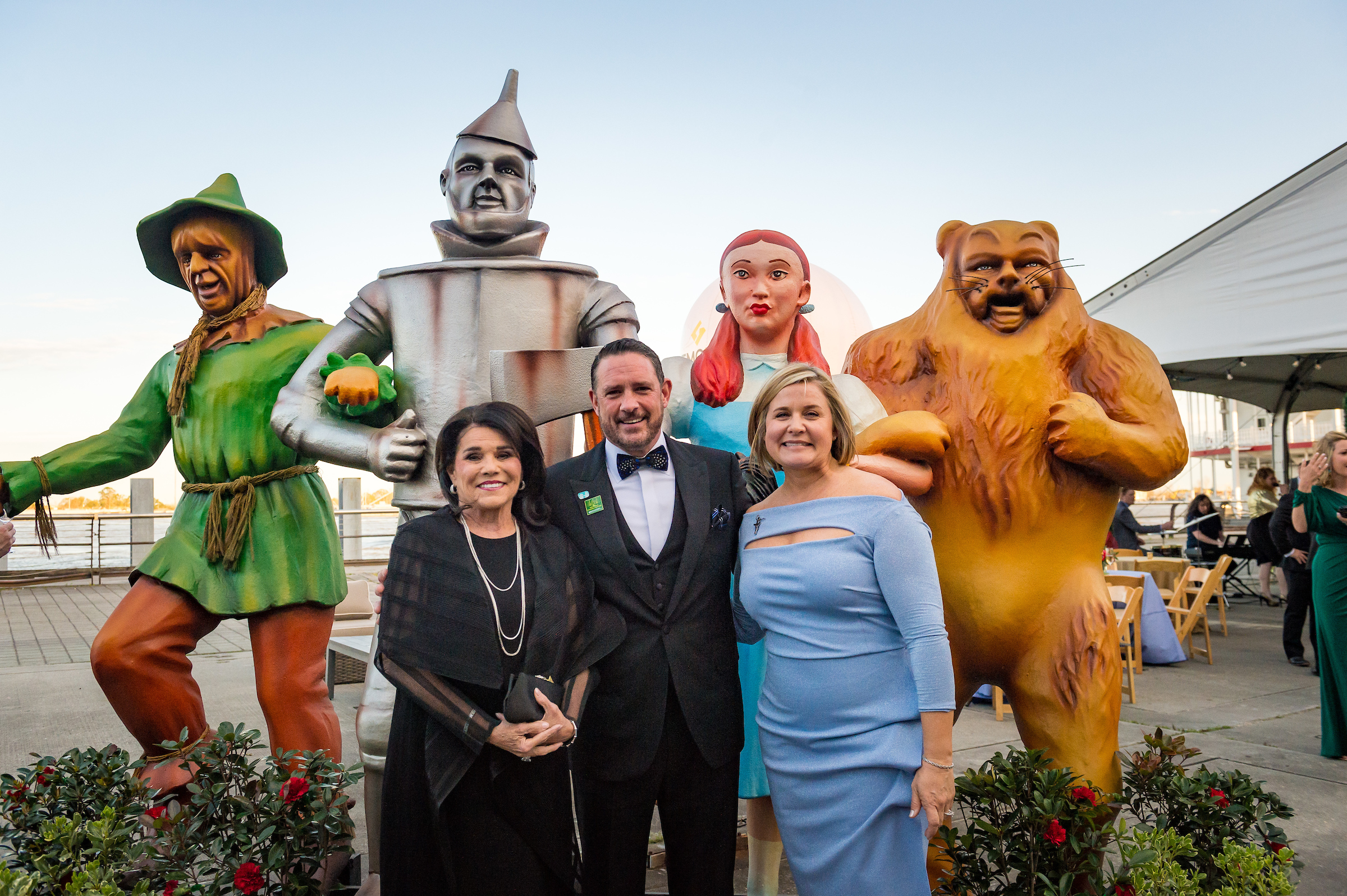 CHNOLA team members posing in front of Wizard of Oz display