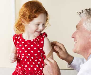 smiling child with doctor