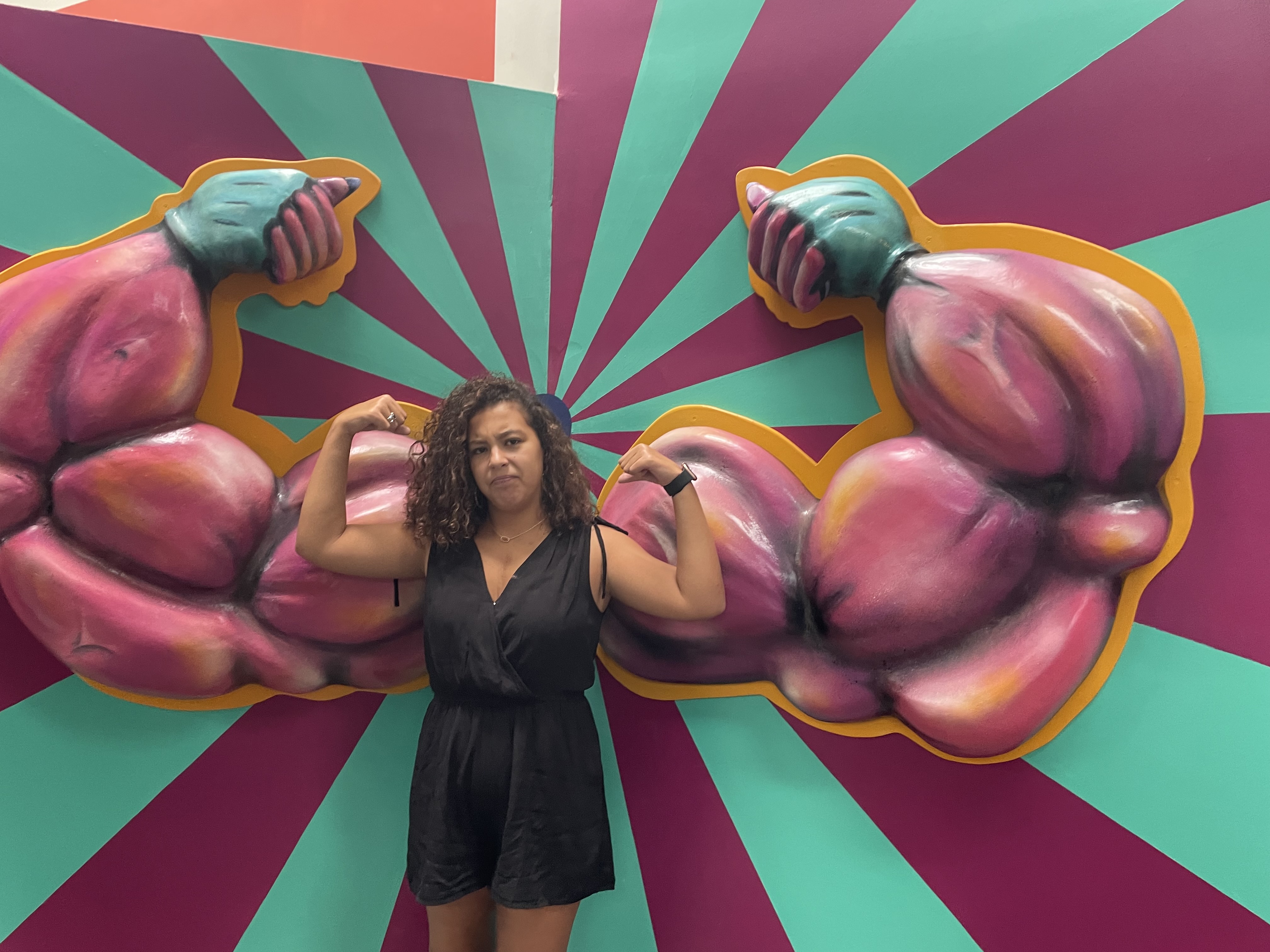 woman showing off her arm muscles 