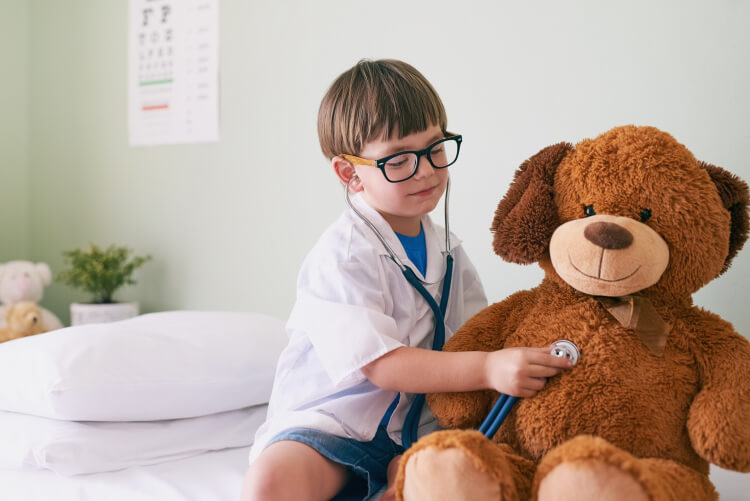 boy with bear playing doctor