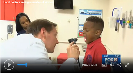 Dr. Thompson checking out a young patient 