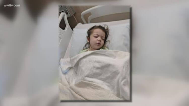 Child laying in hospital bed 